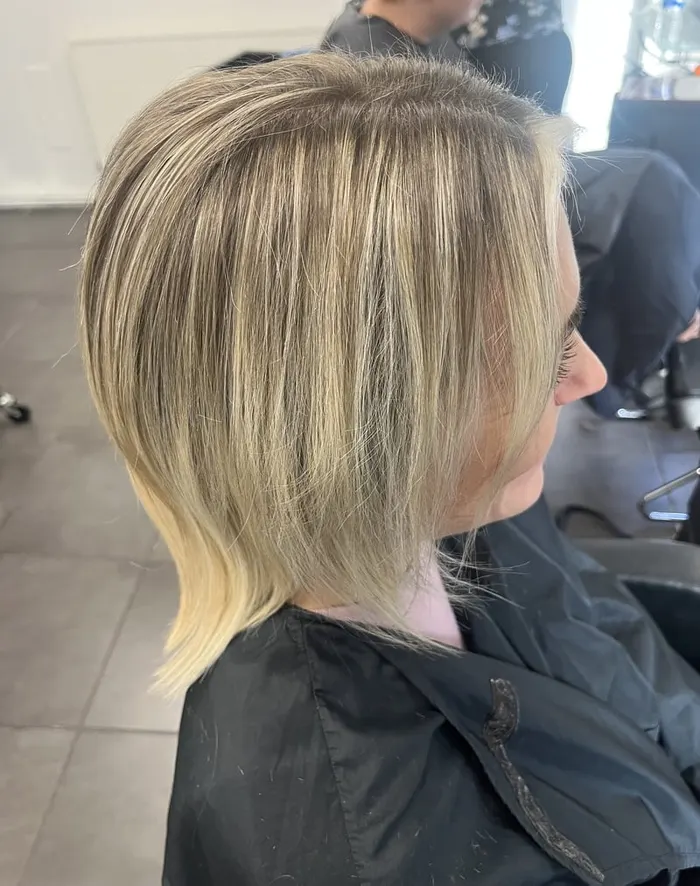 Blonde layered bob with highlights styled at Harvey's Hairdressers, Luton